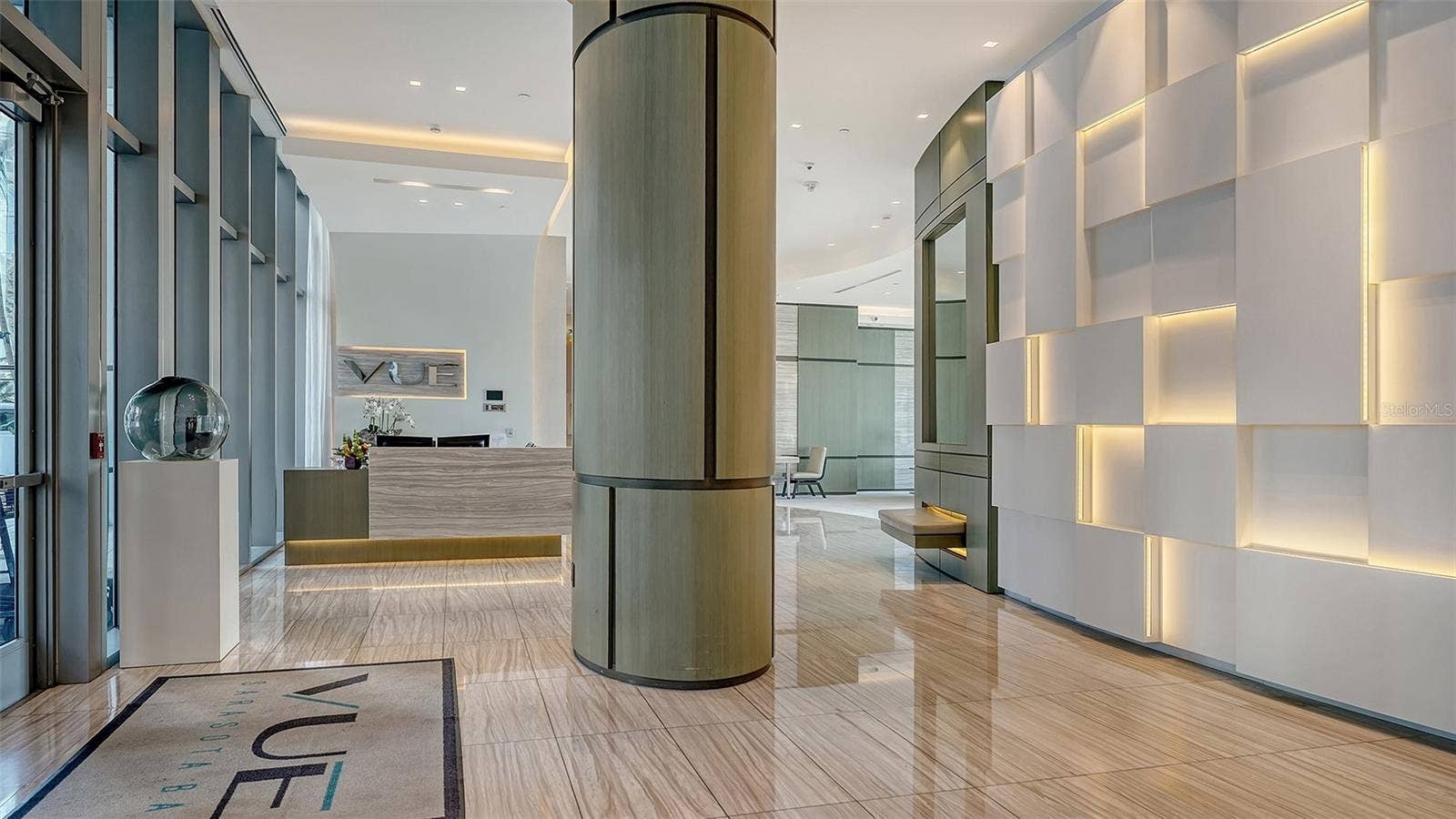 1155 N GULFSTREAM AVENUE, #207, Sarasota, FL 34236 Welcome to The VUE, where a grand lobby with soaring ceilings creates an impressive first impression of luxury and sophistication.