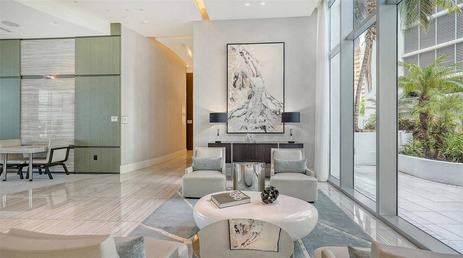 1155 N GULFSTREAM AVENUE, #207, Sarasota, FL 34236 An exquisite lobby showcasing sophisticated design, luxurious finishes, and timeless elegance.