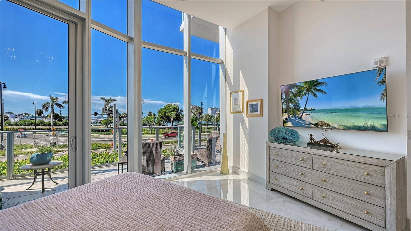 1155 N GULFSTREAM AVENUE, #207, Sarasota, FL 34236 A light-filled primary suite with soaring ceilings, elegant finishes, and a serene, airy ambiance.