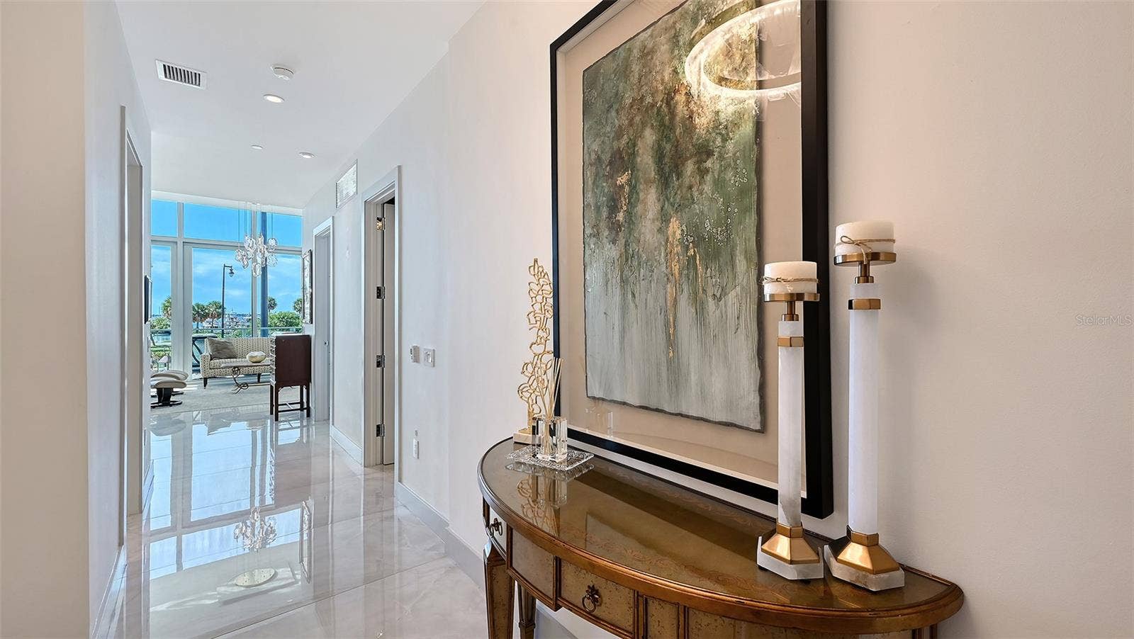 1155 N GULFSTREAM AVENUE, #207, Sarasota, FL 34236 Step into a welcoming foyer with breathtaking views of Sarasota Bay unfolding directly ahead.