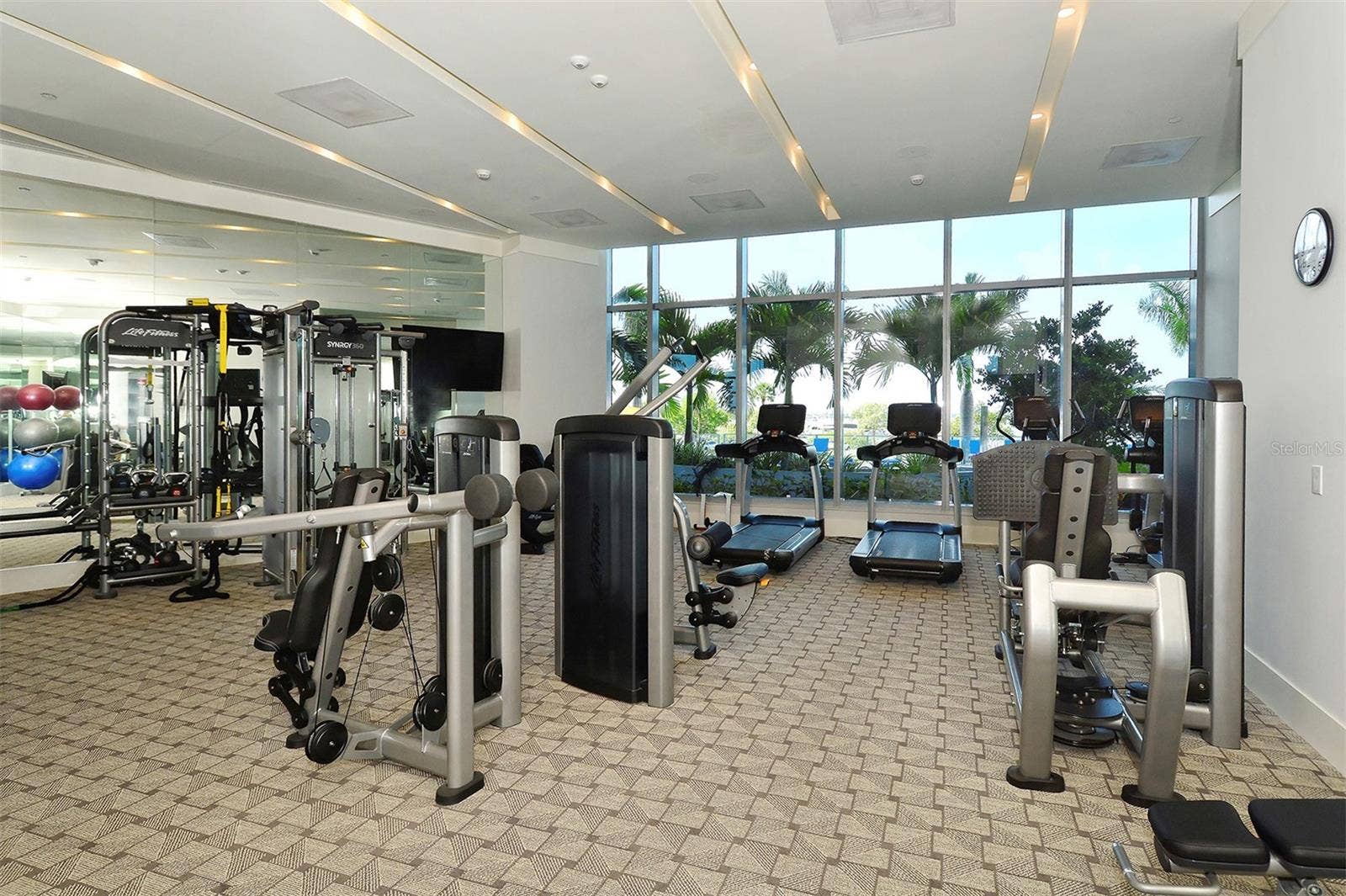 1155 N GULFSTREAM AVENUE, #207, Sarasota, FL 34236 A premier fitness center designed to inspire, with state-of-the-art equipment and stunning pool and Sarasota Bay views that elevate every workout.