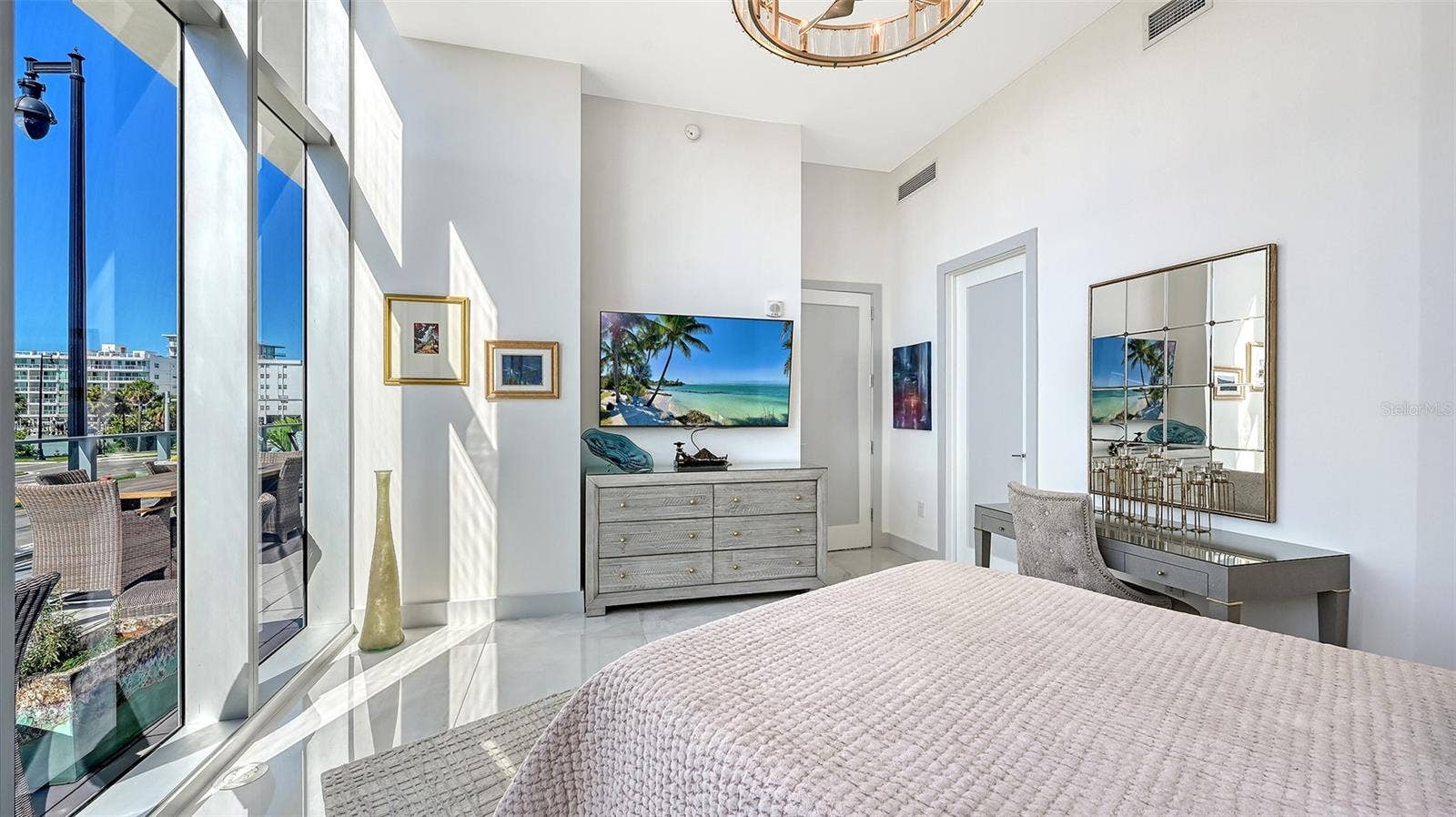 1155 N GULFSTREAM AVENUE, #207, Sarasota, FL 34236 Unwind in the comfort of your luxurious primary suite while enjoying your favorite shows.