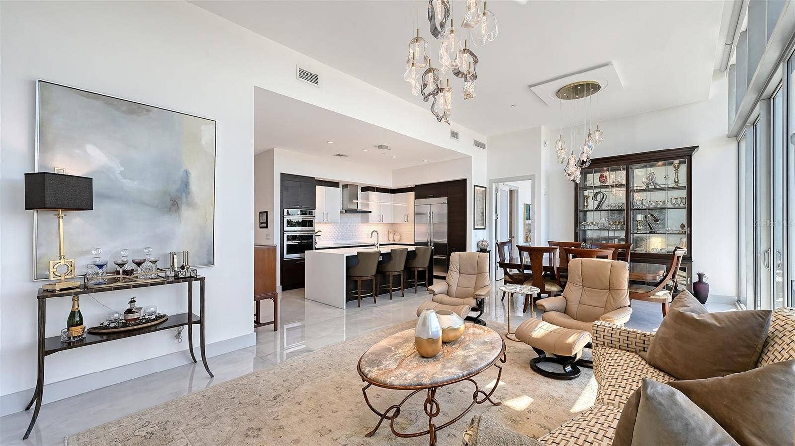 1155 N GULFSTREAM AVENUE, #207, Sarasota, FL 34236 An inviting, spacious living room designed for comfort, relaxation, and effortless elegance.