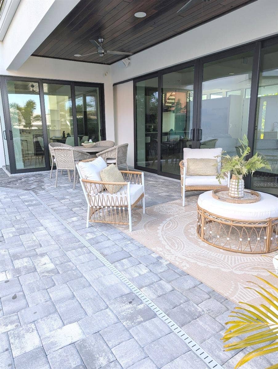 2110 MICHELE DRIVE, Sarasota, FL 34231 Covered lanai with two fans, music speakers and wifi mesh booster
