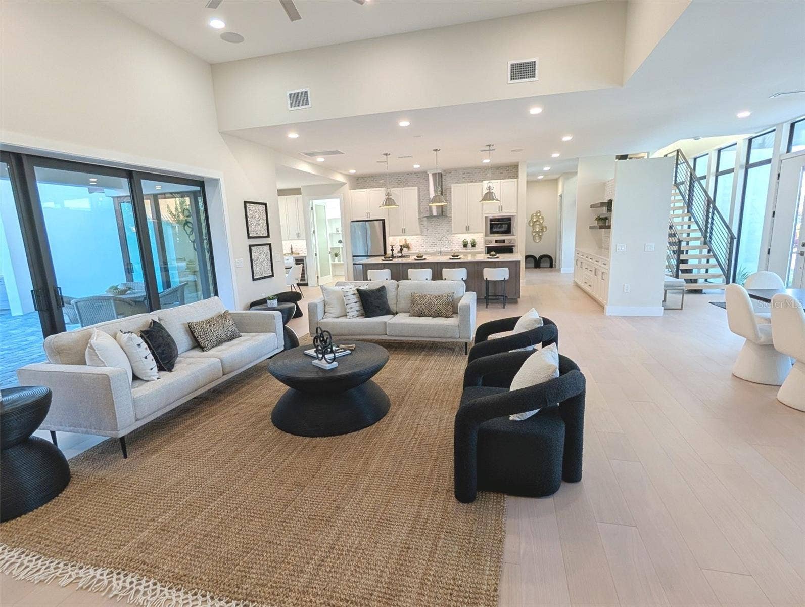 2110 MICHELE DRIVE, Sarasota, FL 34231 Great room with 13 foot ceiling, surround sound speakers, cat 6 wiring throughout, walls, ceiling sound insulated.