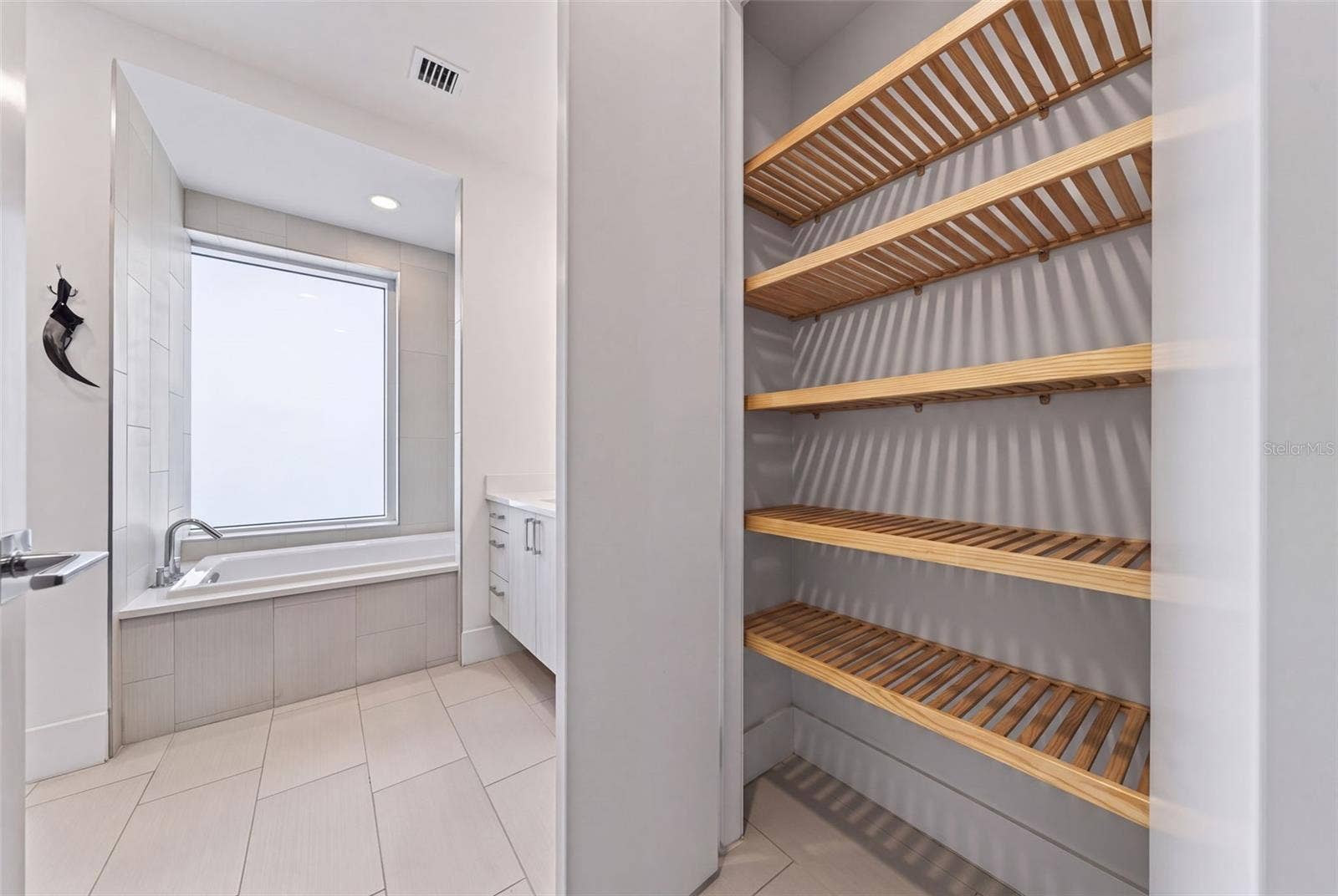 "His" Bath Linen/Toiletry Closet. Primary Ensuite