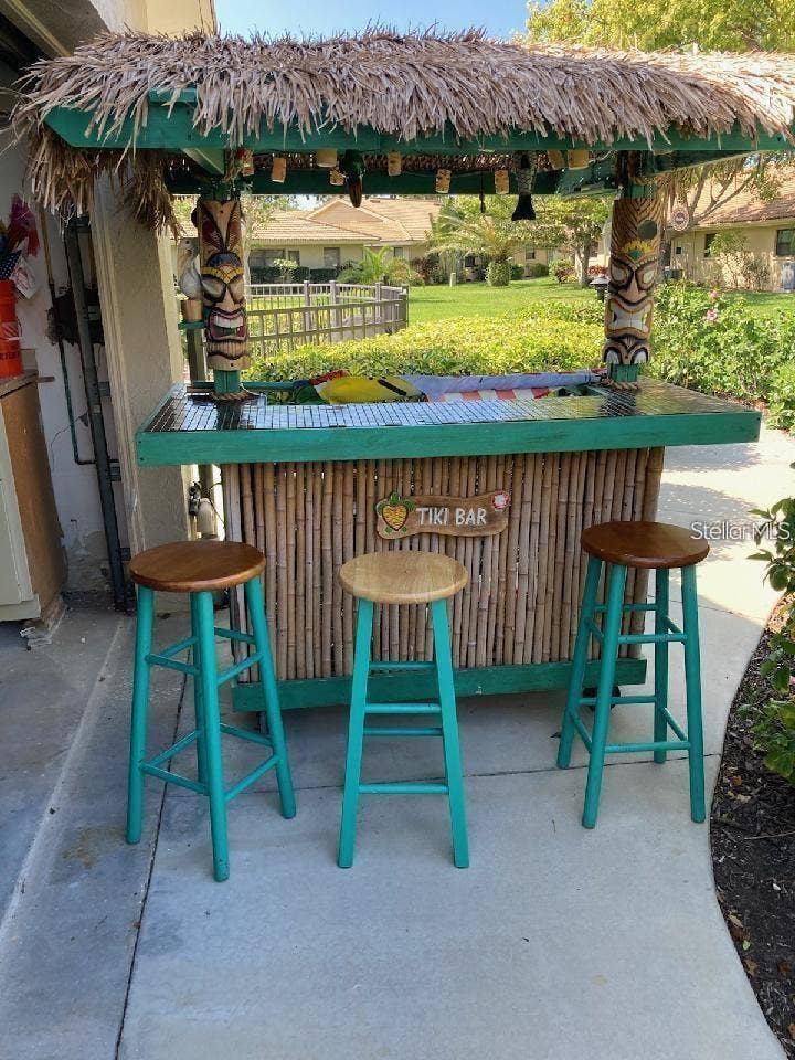 7143 WOOD CREEK DRIVE, #203, Sarasota, FL 34231 POOLSIDE TIKI FOR PARTIES