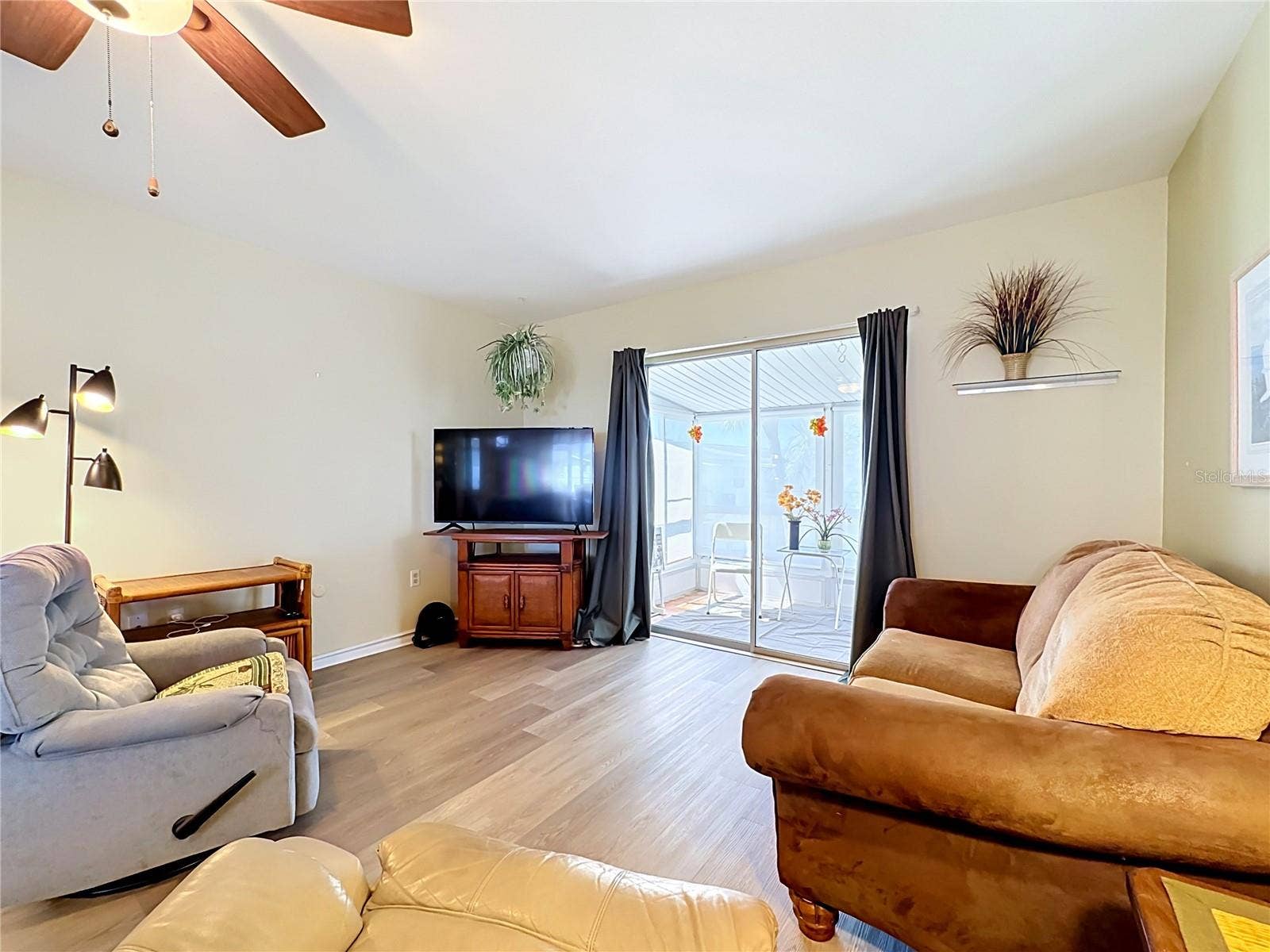 5898 17TH STREET W, #C31, Bradenton, FL 34207 Living Room with Screened Patio View