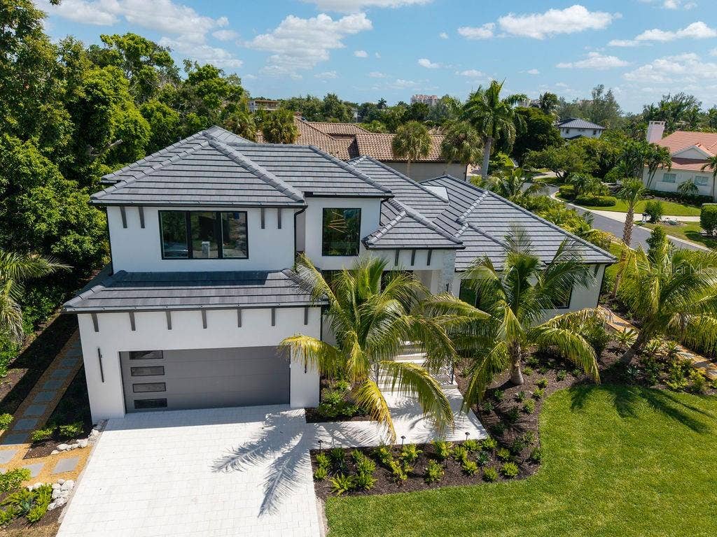 3360 BAYOU SOUND, Longboat Key, FL 34228 Ideally situated in The Bayou, an exclusive enclave behind the gates of Bay Isles.