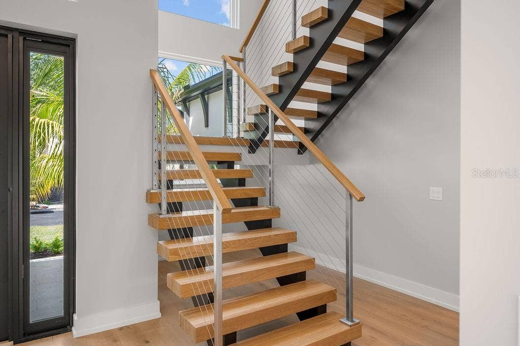 3360 BAYOU SOUND, Longboat Key, FL 34228 Custom designed staircase leading to second floor leading to 3 additional en suite bedrooms.