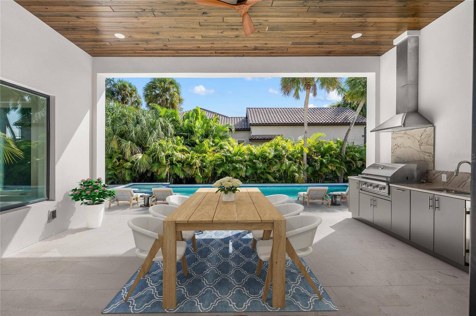 3360 BAYOU SOUND, Longboat Key, FL 34228 Virtually staged, paradise awaits in the under roof outdoor entertaining area with built in luxury kitchen.
