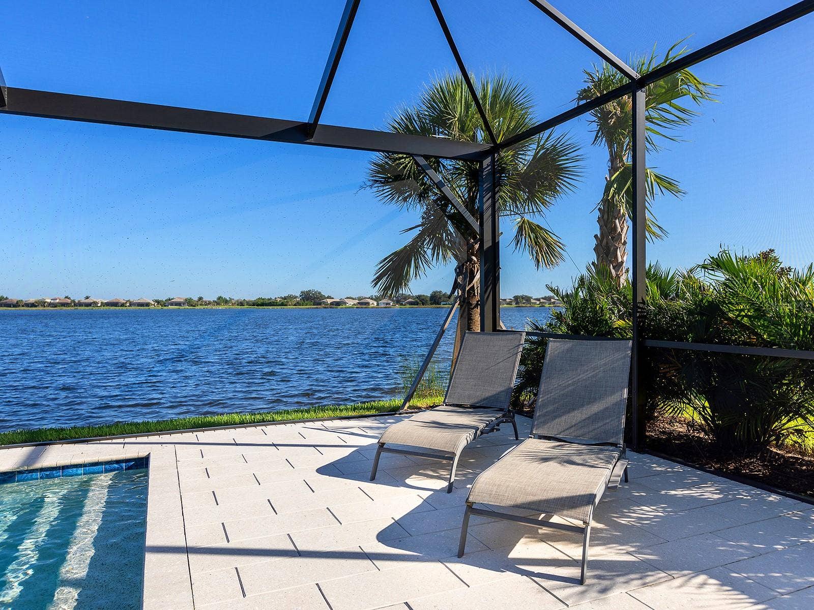 7959 WATERBEND TRAIL, Sarasota, FL 34240 Lounging area lakeside