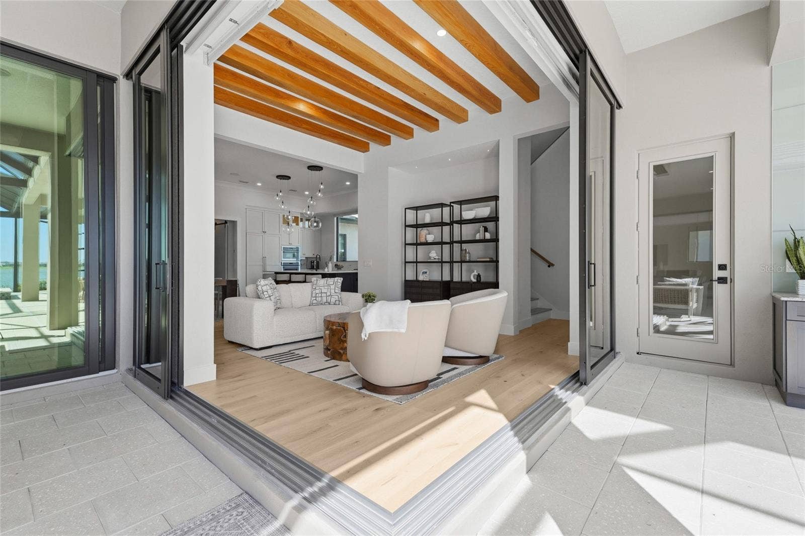 596 BLUE SHELL LOOP, Sarasota, FL 34240 Seamless indoor/outdoor living with frameless corner pocket sliders