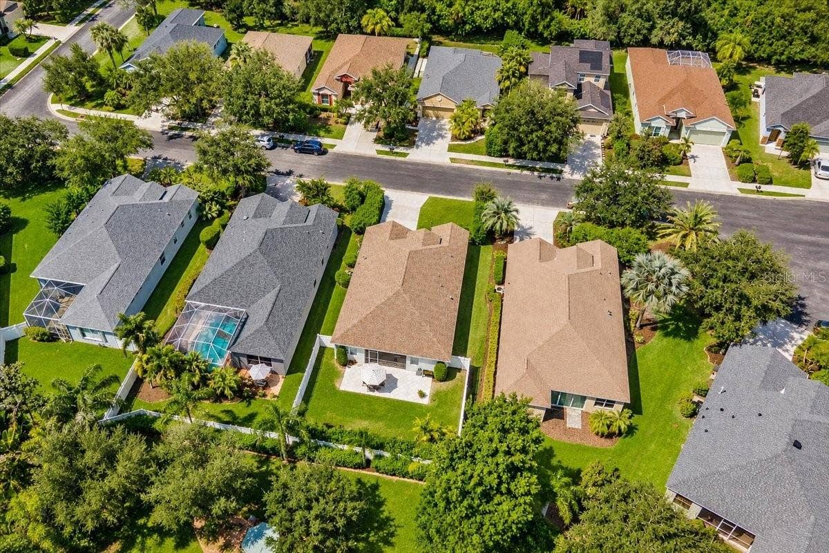 8120 TABBYSTONE PLACE, Bradenton, FL 34201 Fully fenced private yard, extended paver brick patio behind screened in lanai.