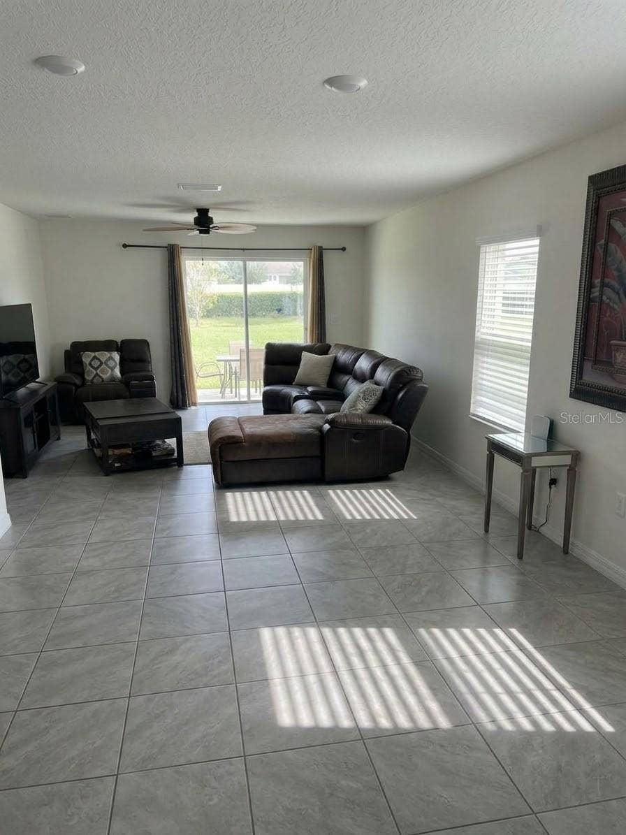 5058 GRANITE DUST PLACE, Palmetto, FL 34221 Open living and dining area