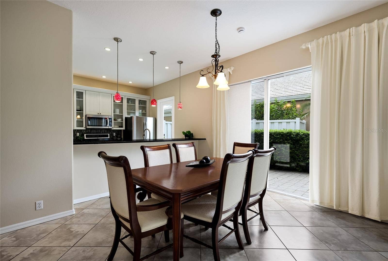 8728 52ND DRIVE E, Bradenton, FL 34211 Large dinging space with access out to the side patio