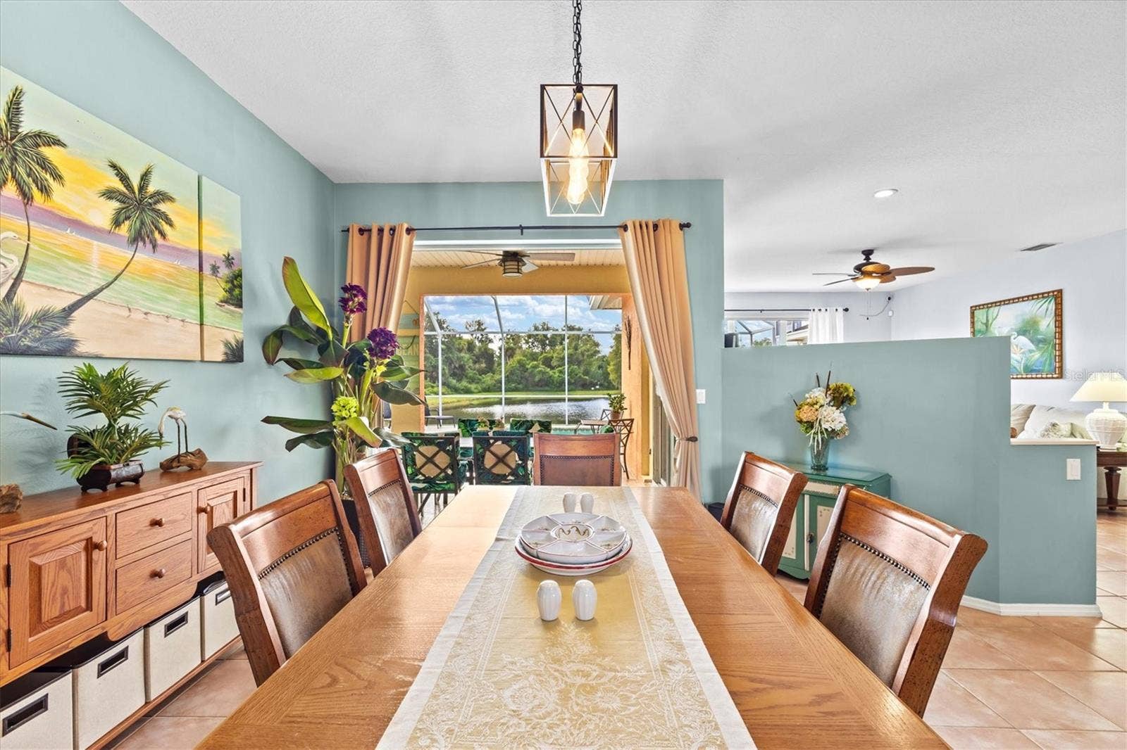 7107 91ST STREET E, Palmetto, FL 34221 When first walking into home-sliders open to pool and water view
