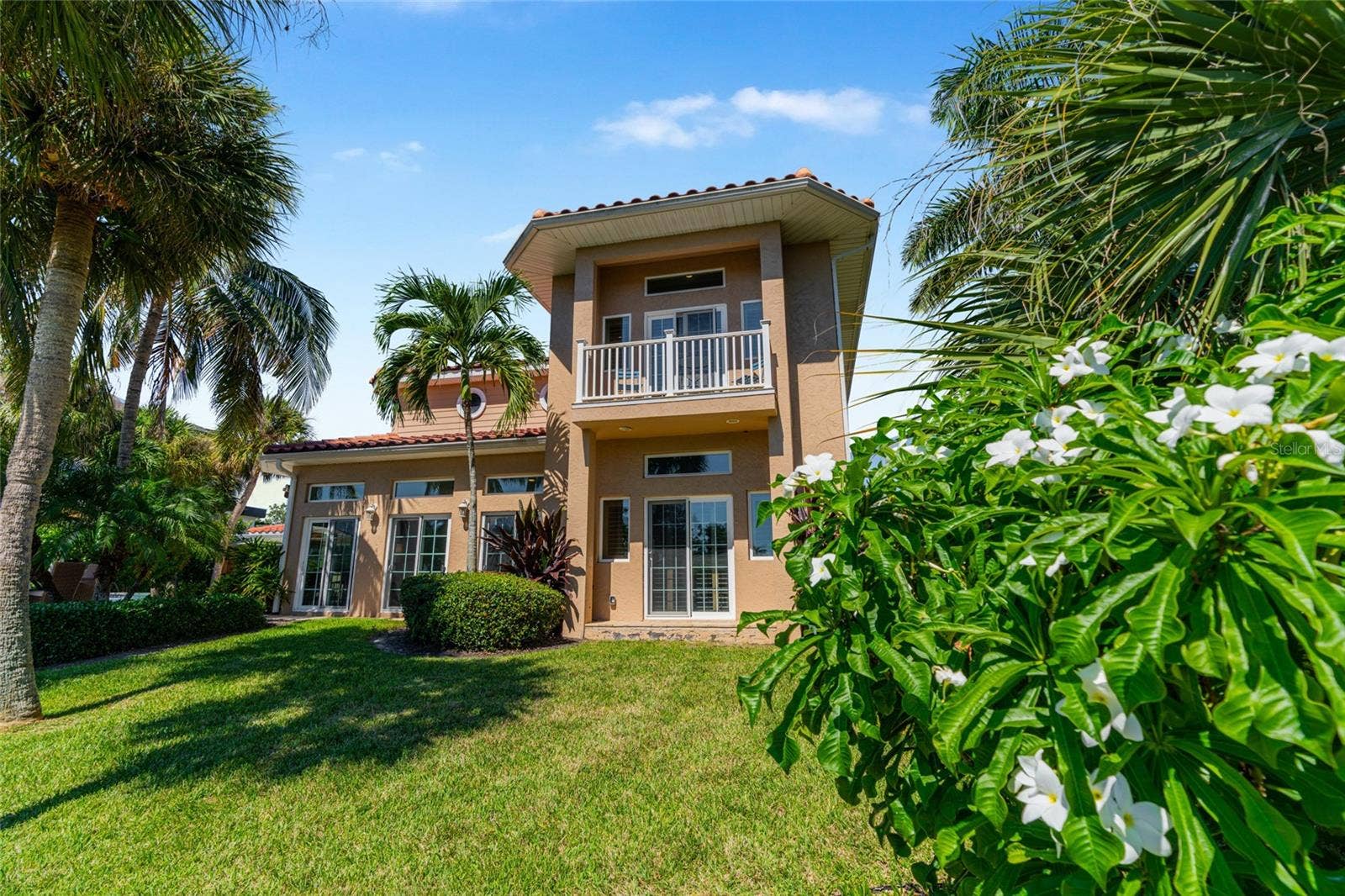 Rear Yard Waterfront, highlighting the connection to the water and Siesta Key lifestyle.