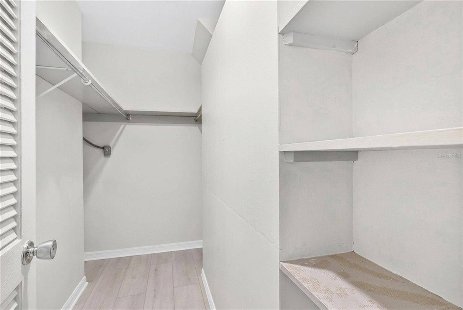 The first floor primary suite includes two walk in closets, providing generous storage.