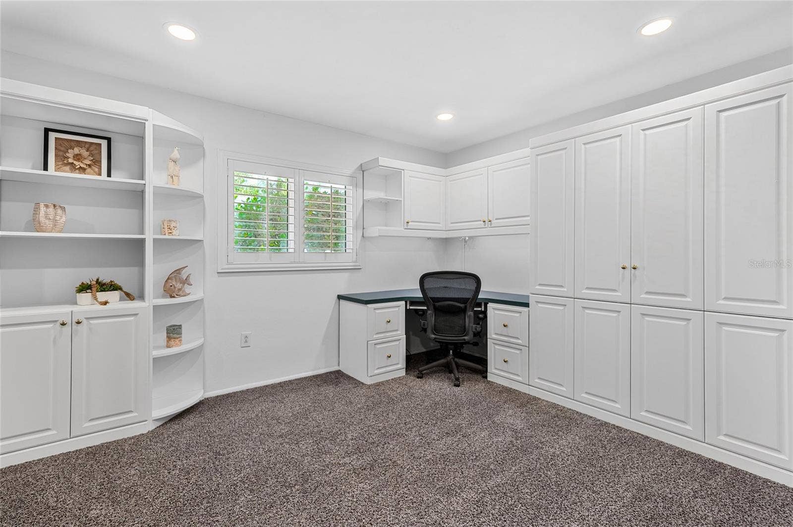 Bedroom 4 with Murphy Bed and Home Office Built Ins.