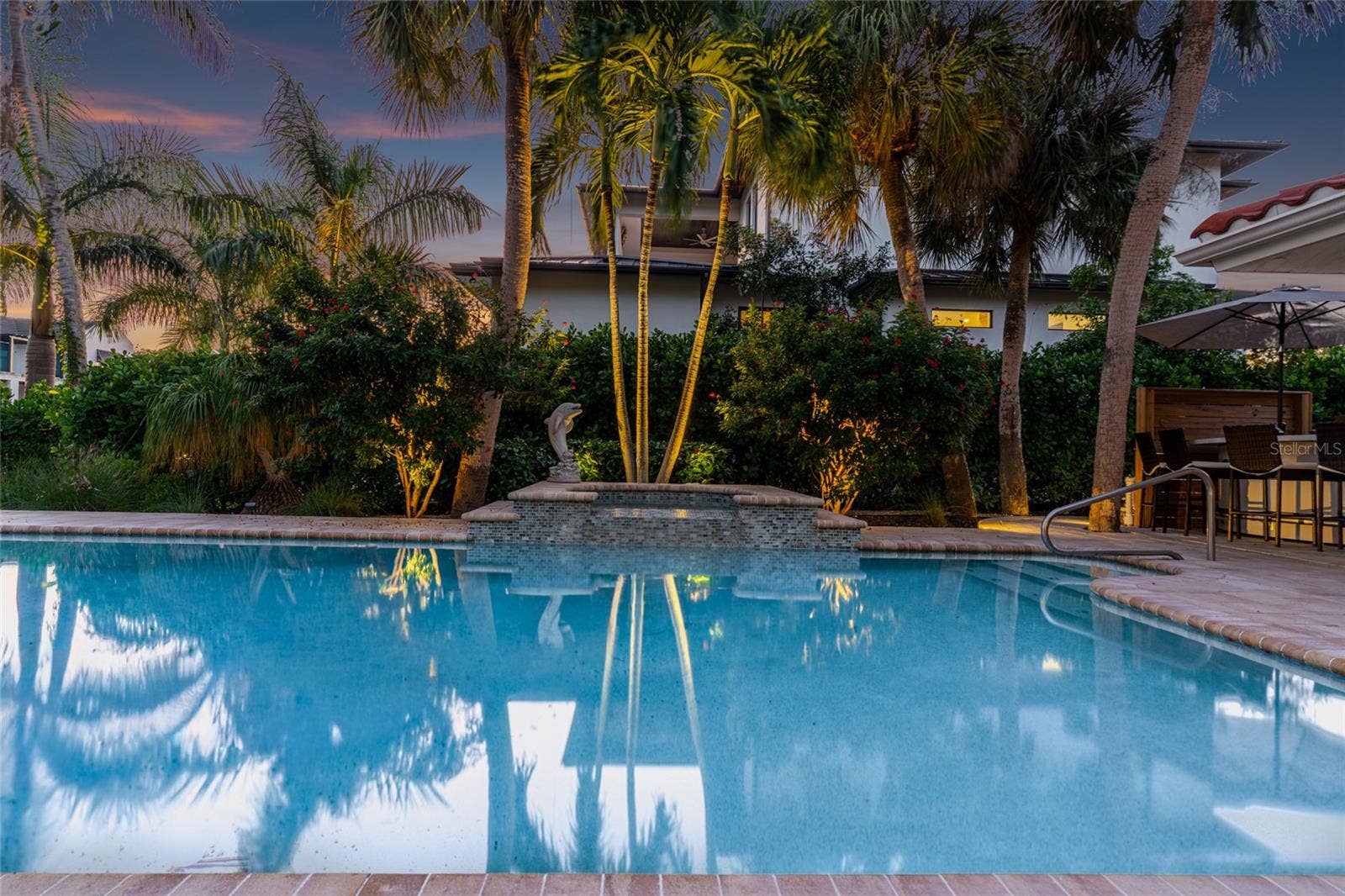 Pool Twilight Reflection, creating an inviting setting for relaxing and entertaining.