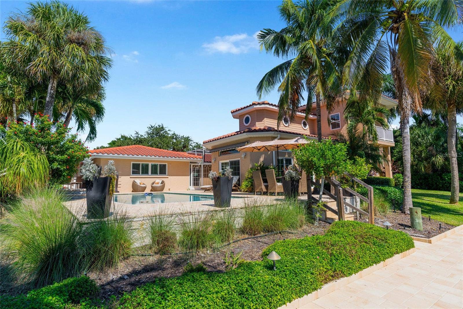 Rear Exterior Waterfront, highlighting the connection to the water and Siesta Key lifestyle.