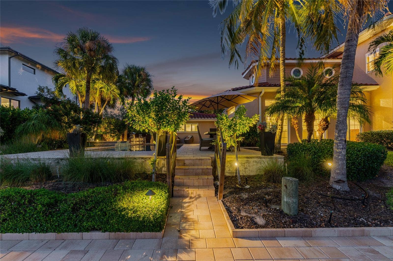 Waterfront Path Night, highlighting the connection to the water and Siesta Key lifestyle.