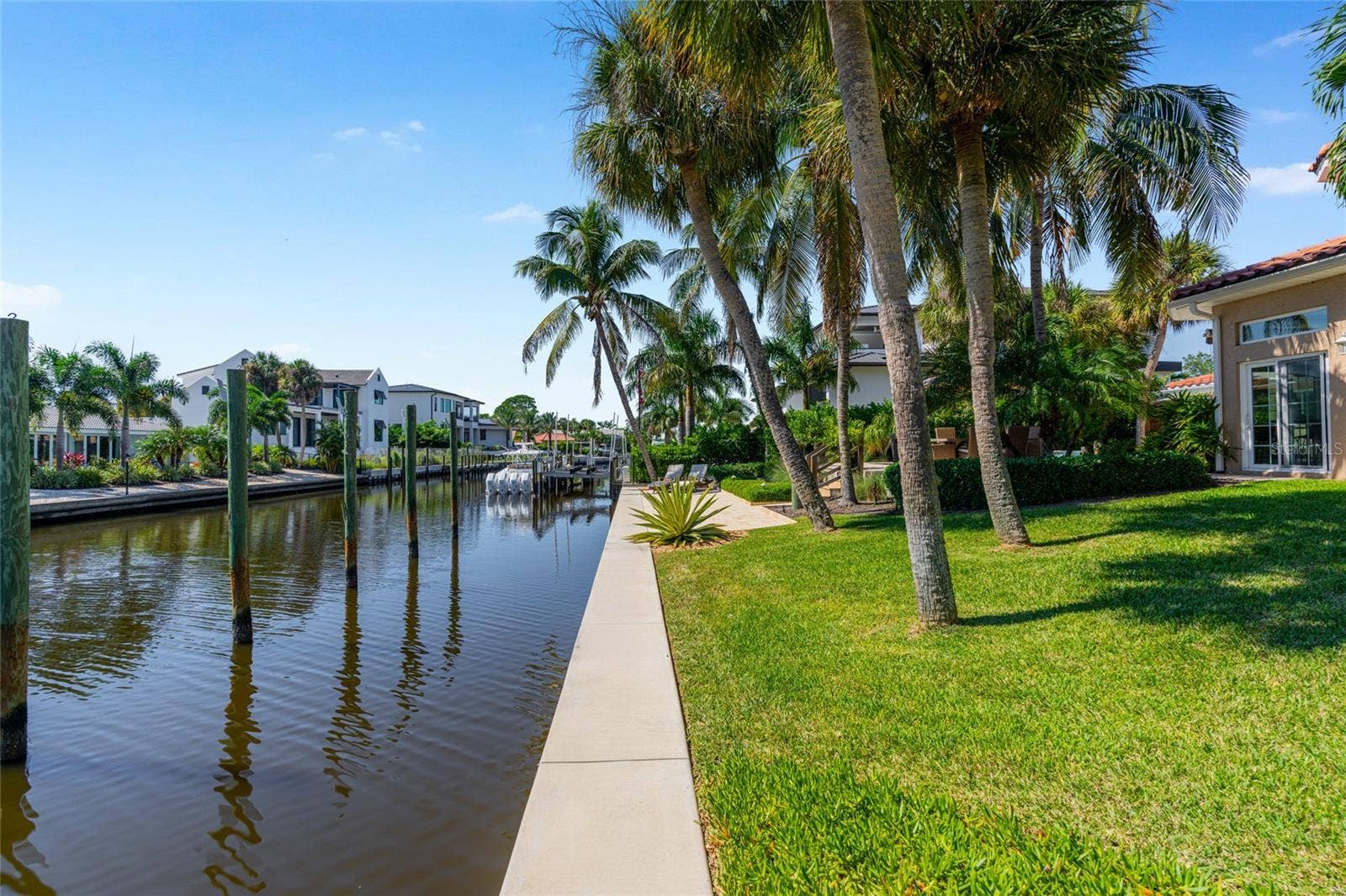 Canal Frontage View, highlighting the connection to the water and Siesta Key lifestyle.