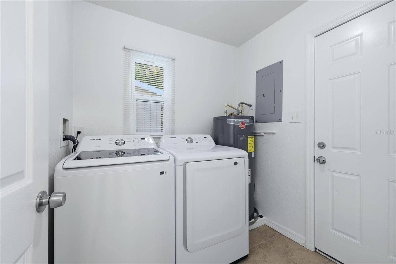1240 HIGHLAND STREET, Sarasota, FL 34234 New washer and dryer in laundry room. Access door to the backyard.