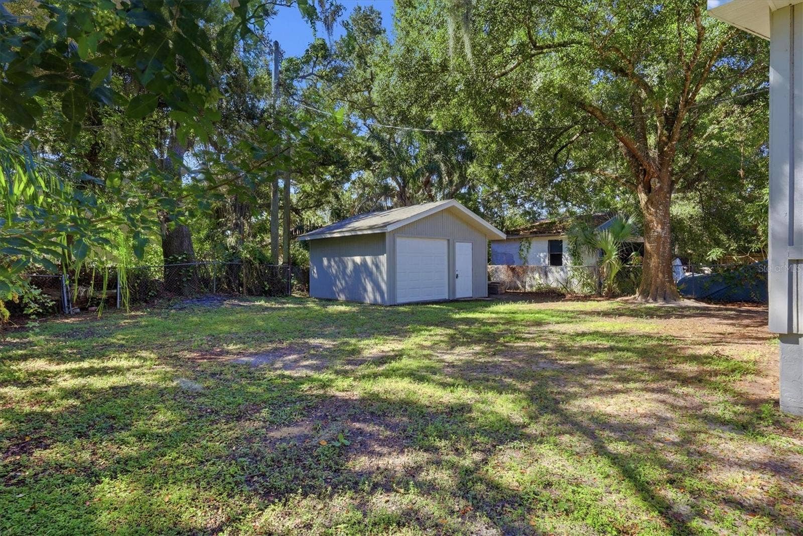 1240 HIGHLAND STREET, Sarasota, FL 34234 Backyard and detached garage.