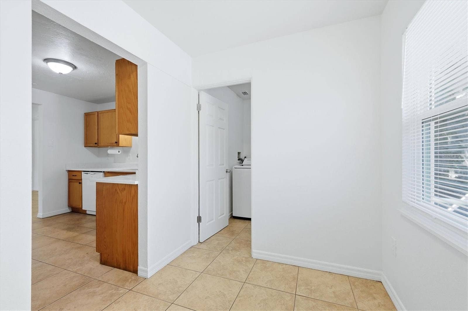 1240 HIGHLAND STREET, Sarasota, FL 34234 Breakfast nook opens to kitchen and laundry room.