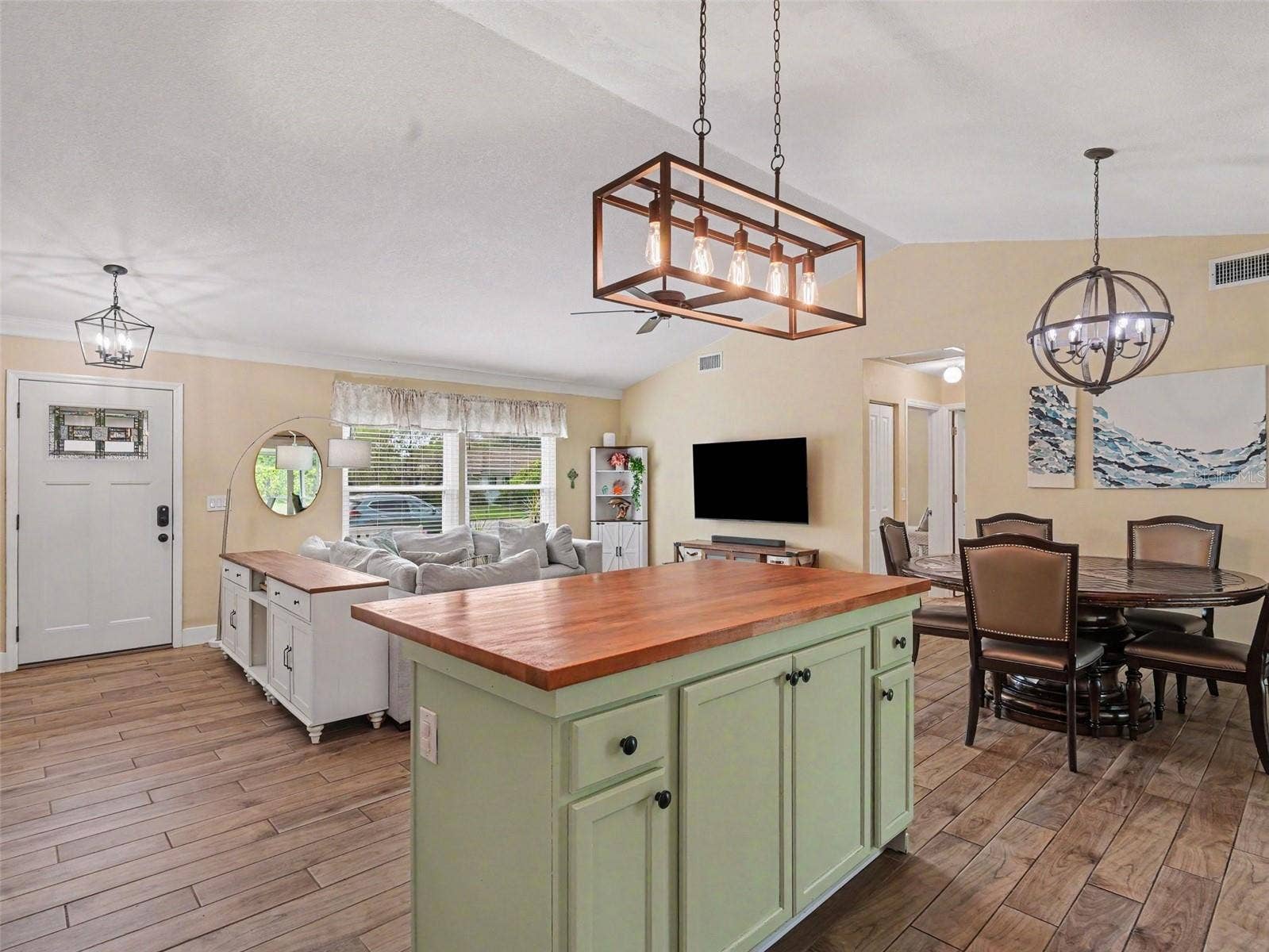 Kitchen opens to dining and living