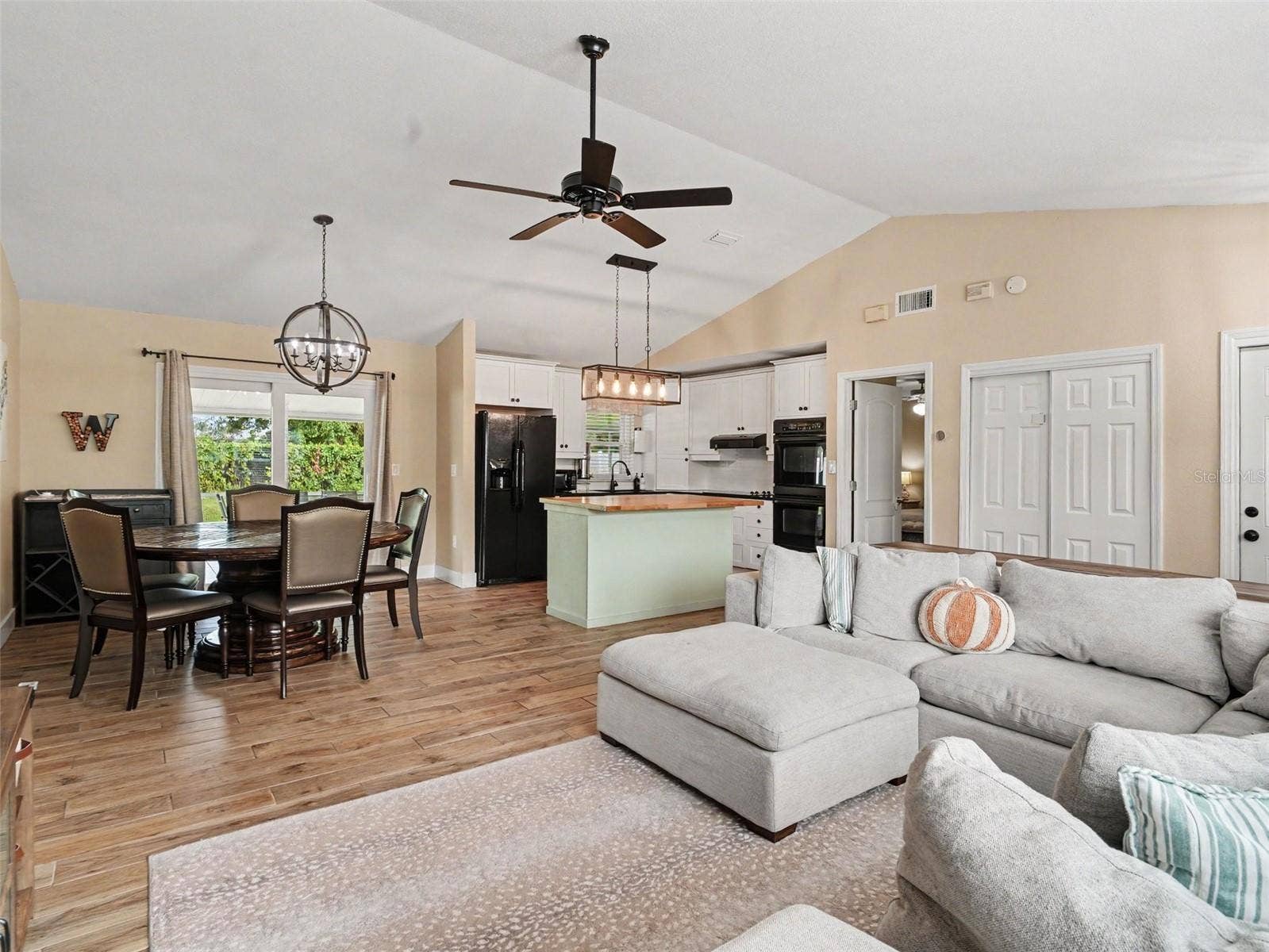 Living opens to Dining and Kitchen