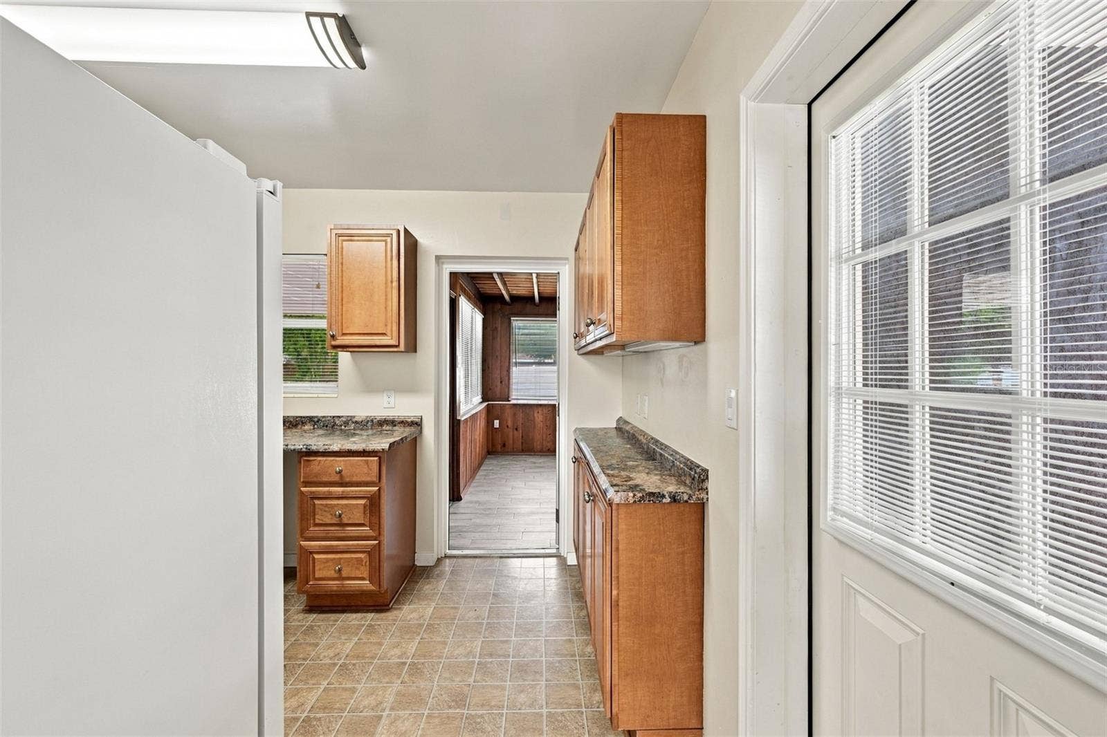1007 21ST AVENUE W, Palmetto, FL 34221 Kitchen Bar Area with Bonus Room Beyond