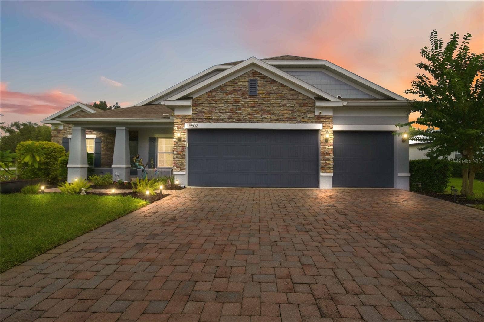 15502 31ST STREET E, Parrish, FL 34219 Twilight front exterior with welcoming curb appeal.