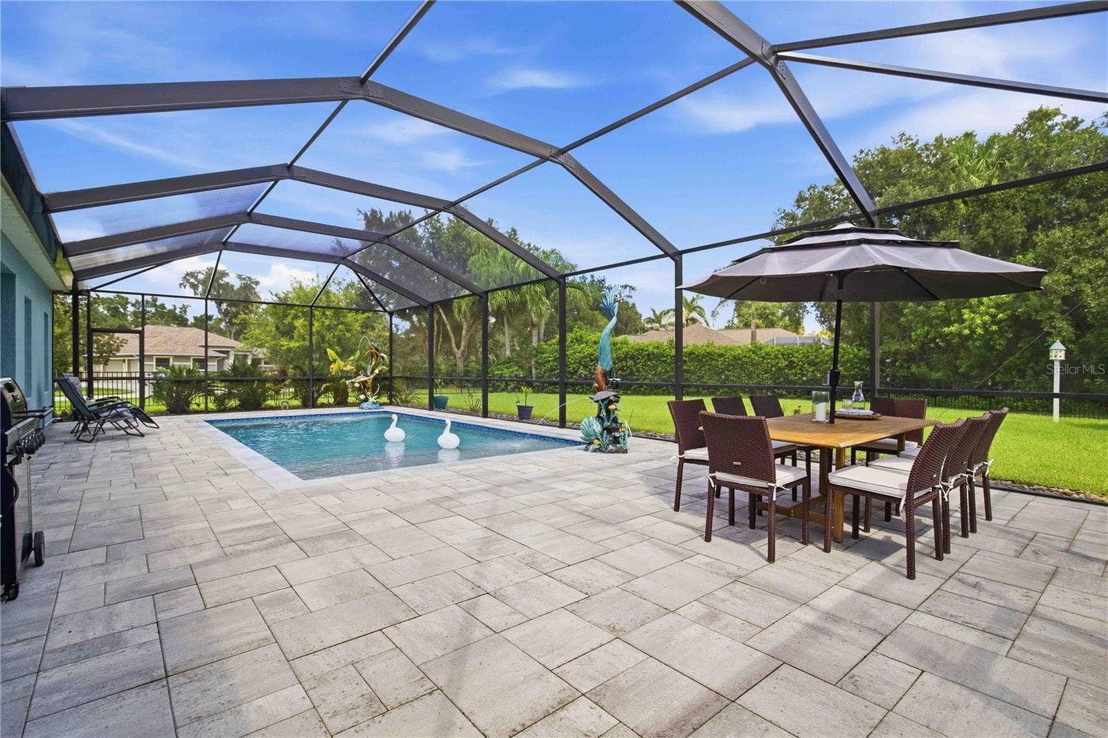 15502 31ST STREET E, Parrish, FL 34219 Outdoor dining overlooking the pool