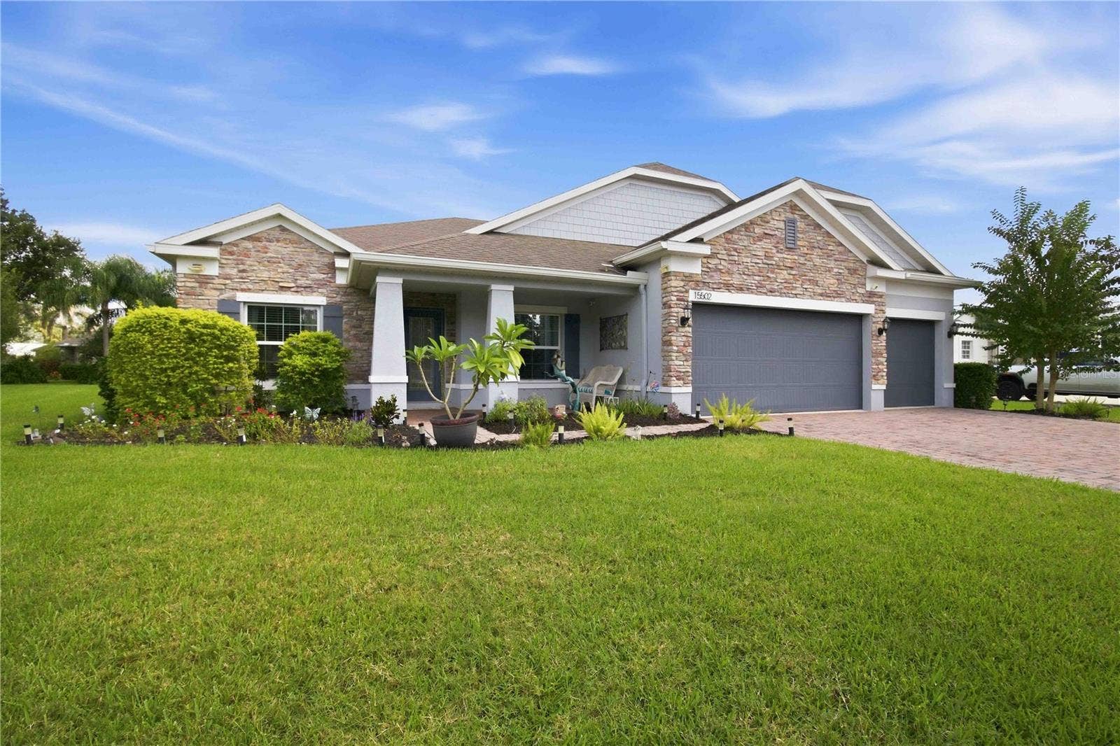 15502 31ST STREET E, Parrish, FL 34219 Spacious front yard with mature landscaping.