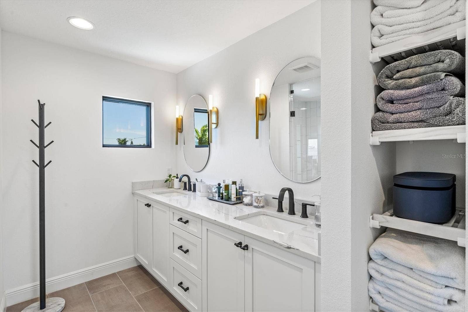 1914 RIVERSIDE DRIVE E, Bradenton, FL 34208 Primary suite bath with dual sinks.