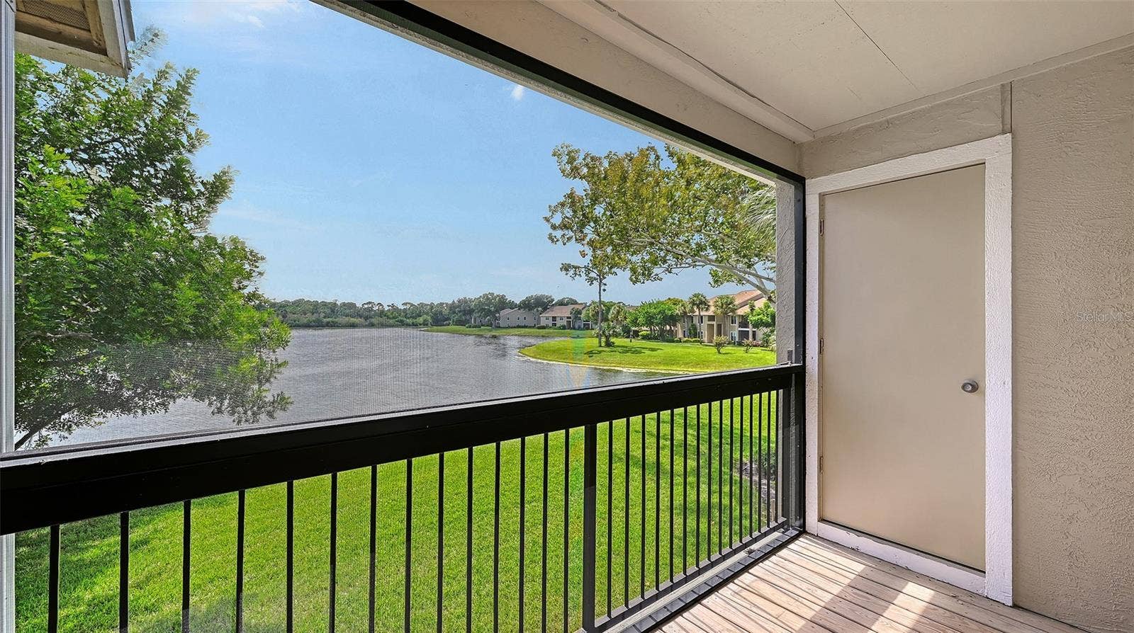 4025 CROCKERS LAKE BOULEVARD, #22, Sarasota, FL 34238 Balcony & storage Room