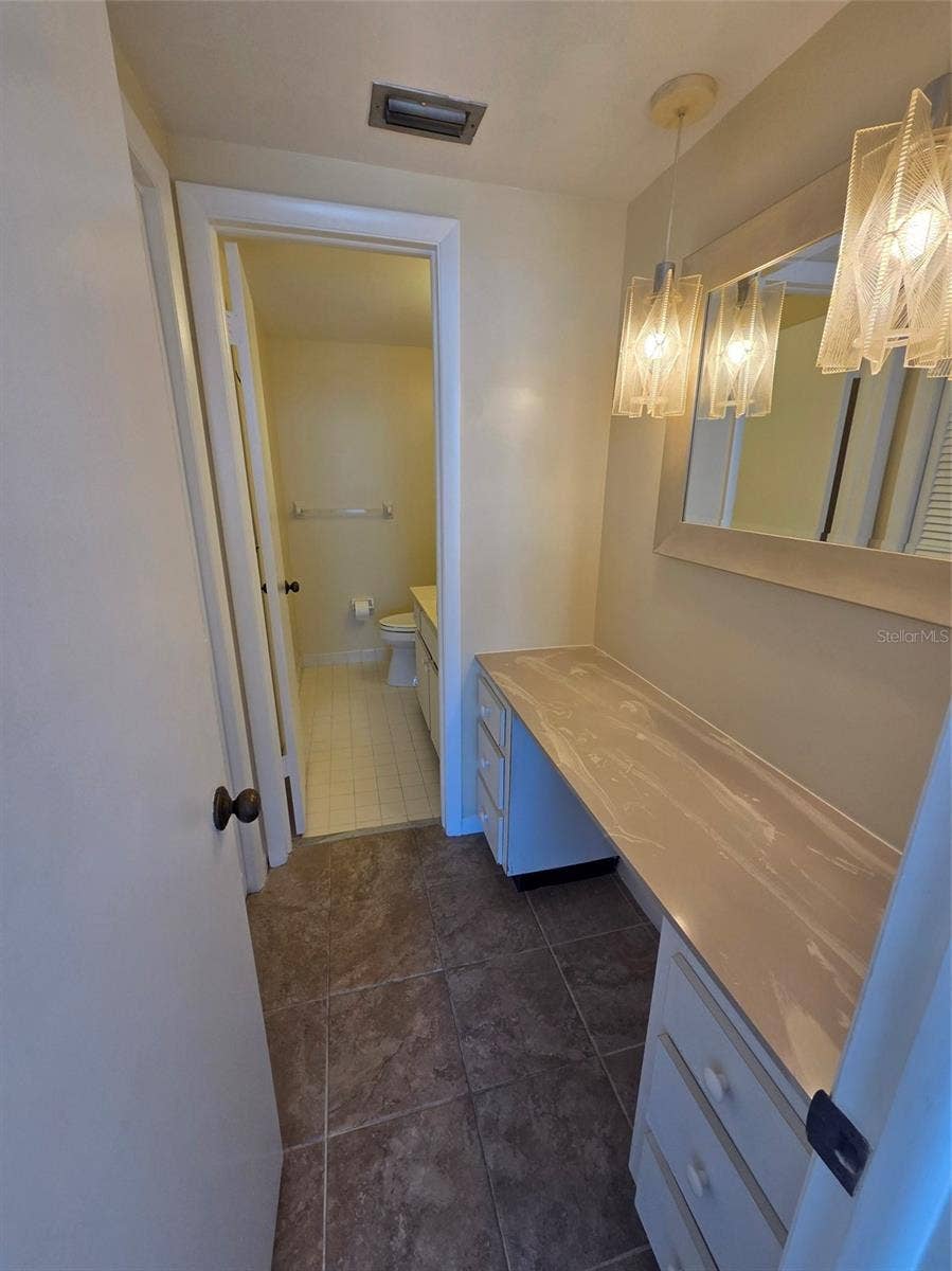 7100 SUNSHINE SKYWAY LANE S, #301, St Petersburg, FL 33711 Owners bedroom vanity area