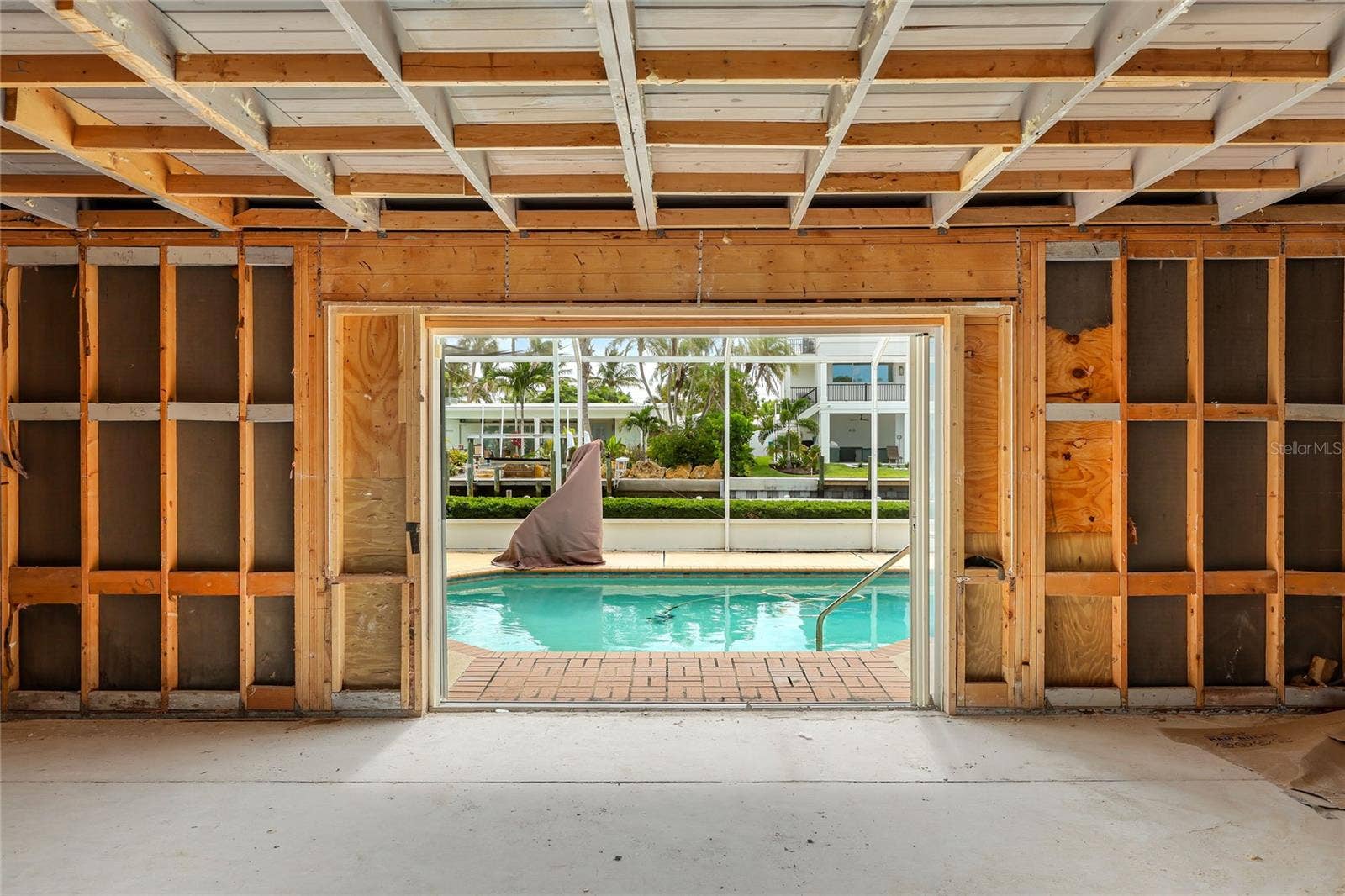 517 71ST STREET, Holmes Beach, FL 34217 View from the front entry area to the pool and on out to the dock and canal