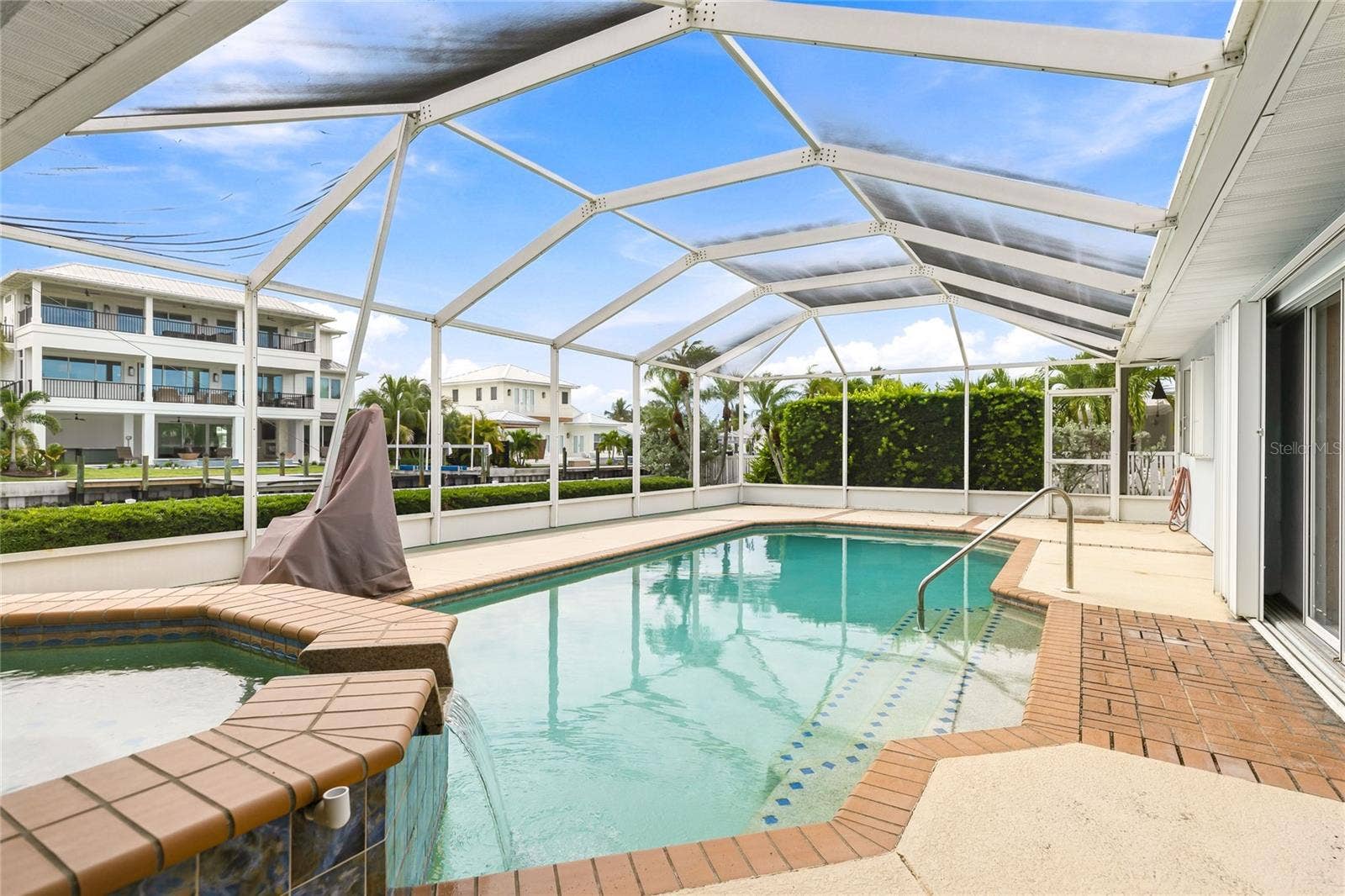 517 71ST STREET, Holmes Beach, FL 34217 Screened pool and spa area