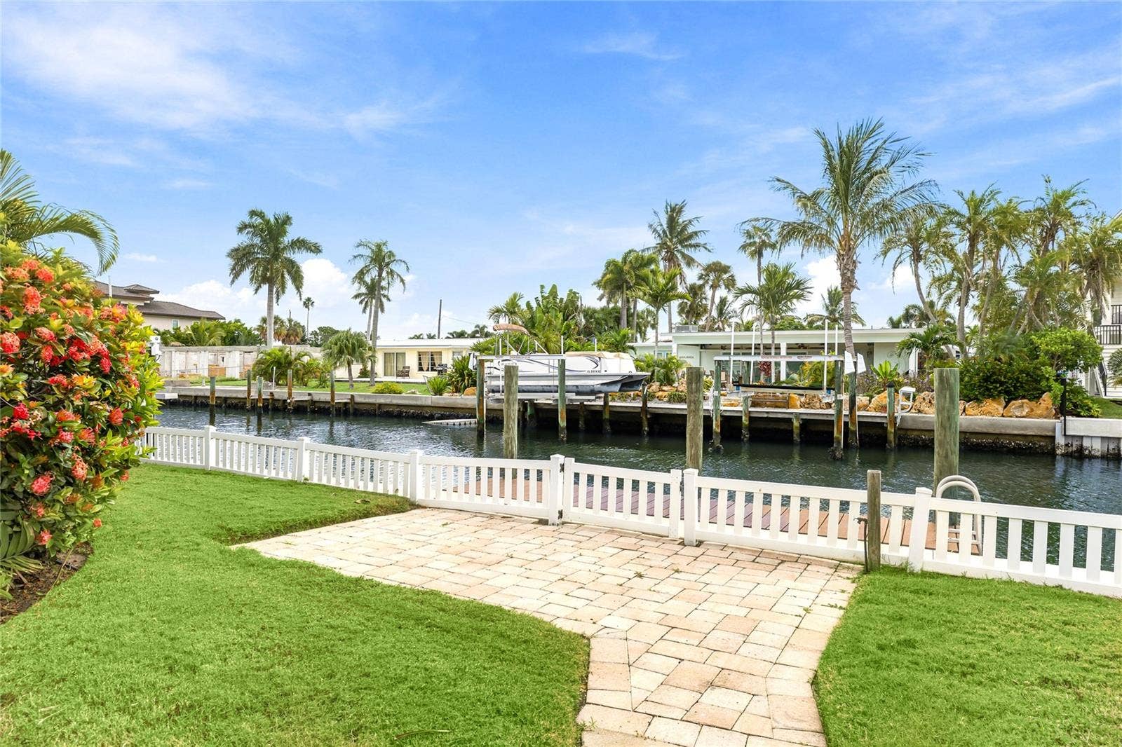 517 71ST STREET, Holmes Beach, FL 34217 Walkway from the pool area to the dock and canal