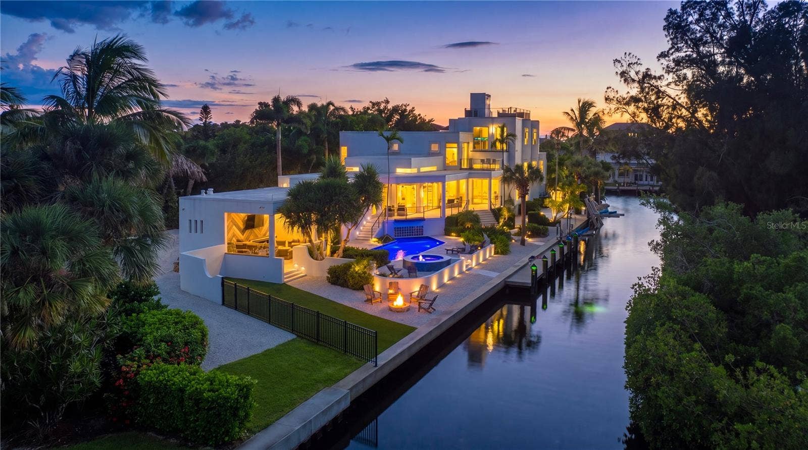 3718 SANDSPUR LANE, Nokomis, FL 34275 As the sunsets, this residence captures the glow