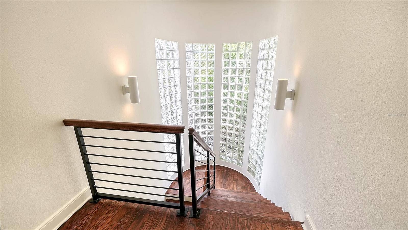 3718 SANDSPUR LANE, Nokomis, FL 34275 Glass windows line the stairway to the primary suite