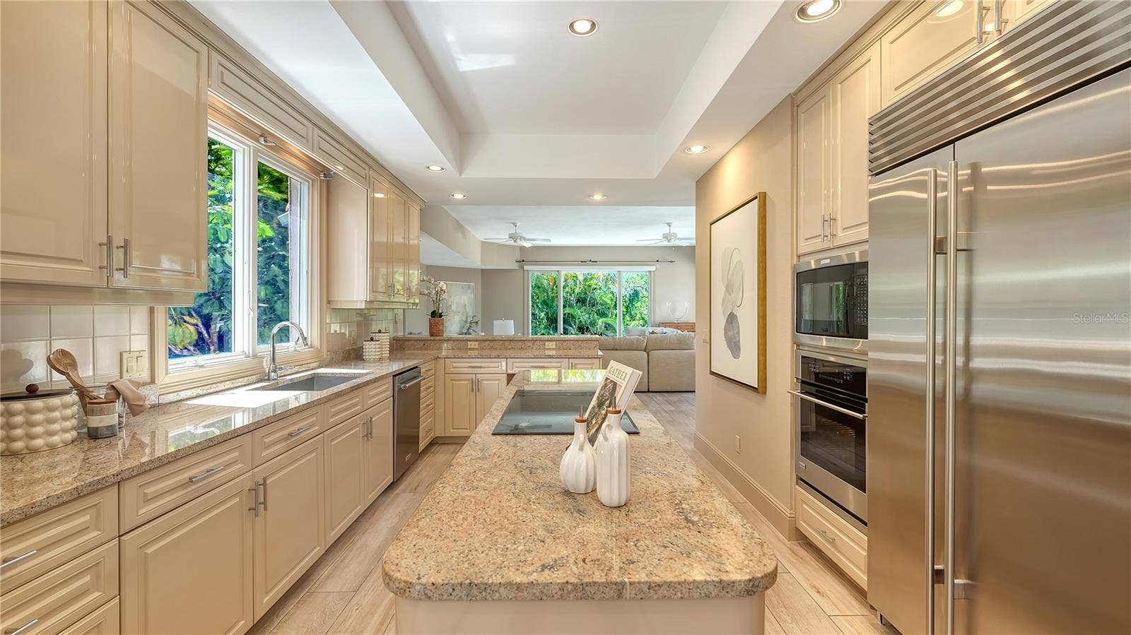 168 COASTAL HAMMOCK COURT, Osprey, FL 34229 Stone countertops, generous cabinetry and premium appliances combine function with timeless design.