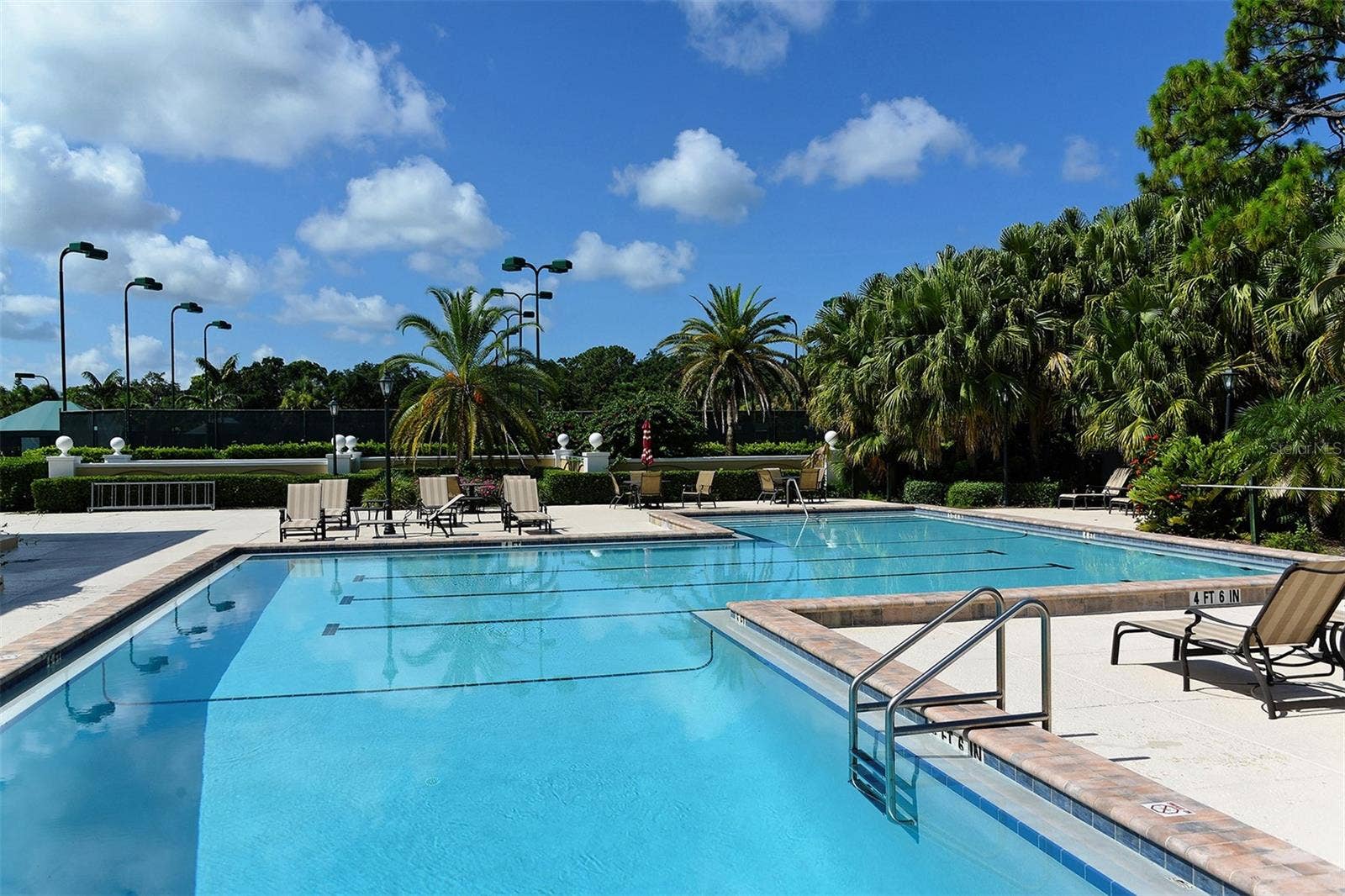 168 COASTAL HAMMOCK COURT, Osprey, FL 34229 The Oaks offers a spacious pool setting for recreation, relaxation and enjoying the Florida sunshine.