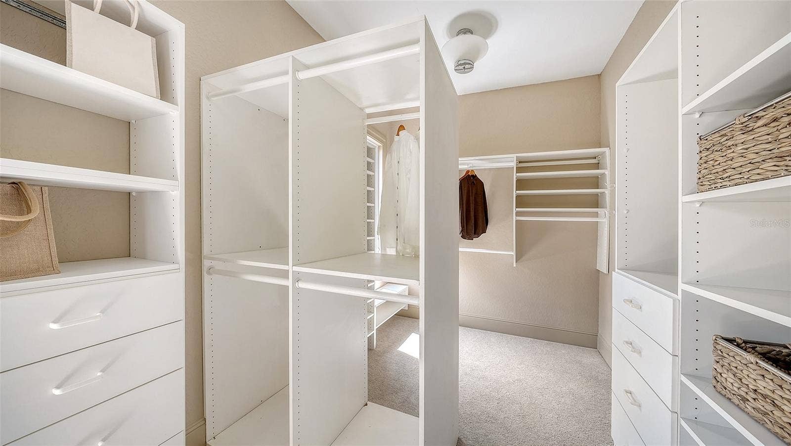 168 COASTAL HAMMOCK COURT, Osprey, FL 34229 Custom designed storage provides extensive organization within the private primary suite level.