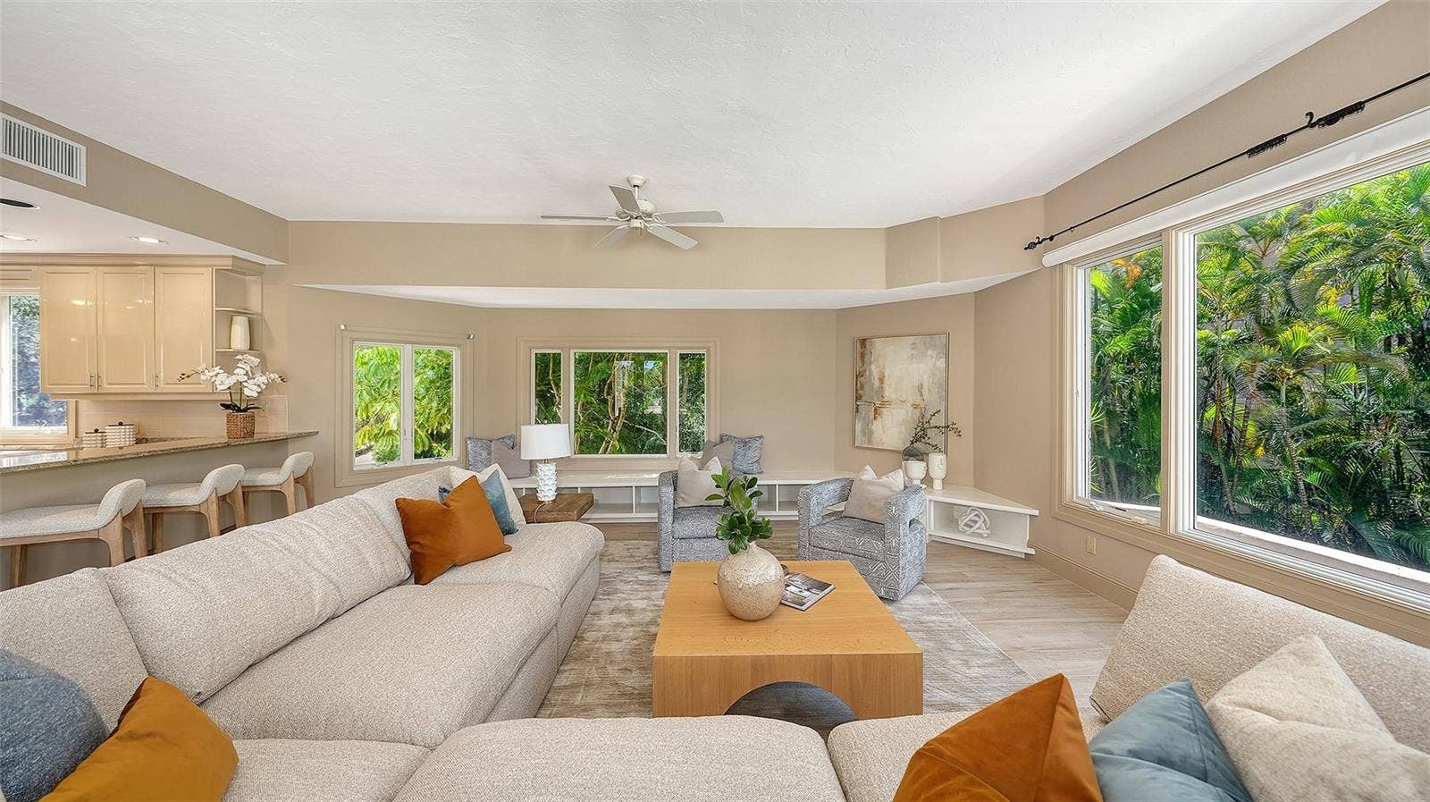 168 COASTAL HAMMOCK COURT, Osprey, FL 34229 A spacious family room provides an inviting setting for everyday living while maintaining the home's sophisticated character.