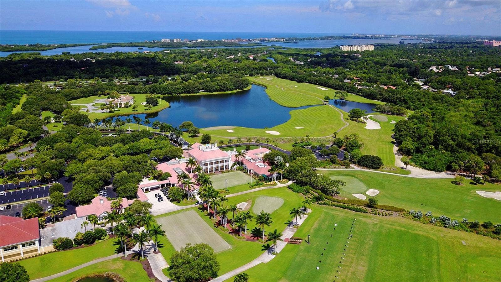 168 COASTAL HAMMOCK COURT, Osprey, FL 34229 Beautifully maintained fairways and lakes showcase the exceptional golf lifestyle offered at The Oaks.